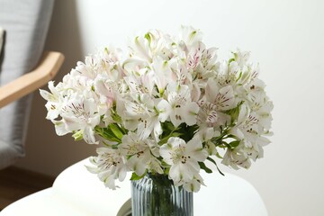 Beautiful white alstroemeria 
in a vase on the table