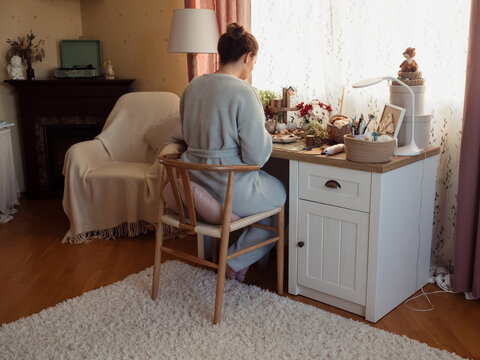 Woman in Home Wear Crafting at Her Cozy Desk