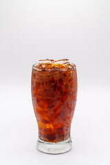 Glass full of Pepsi and cold ice on white background.