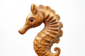 Fototapeta premium Close up of a wooden seahorse figurine isolated Isolated on a white background