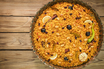 Arabic Cuisine; Arabic basmati rice with various of aromatic spices and dried limes. Served with delicious Daqoos sauce.