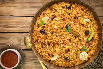 Arabic Cuisine; Arabic basmati rice with various of aromatic spices and dried limes. Served with delicious Daqoos sauce.