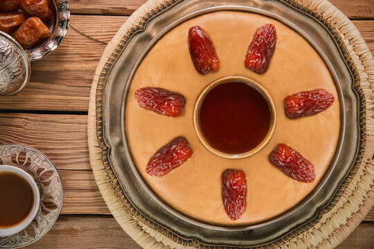 Arabic Cuisine; 'Aseeda' is one of the most popular desserts and traditional dish in many Arab countries. Often served during religious holidays. Served with honey, butter and dates.