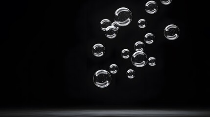 Transparent Bubbles Floating Against Black Background