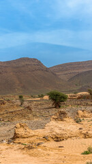 Moroccan Sahara Desert, ancient black volcanic mountains, the Sahara River Oued Ghris, stunning...