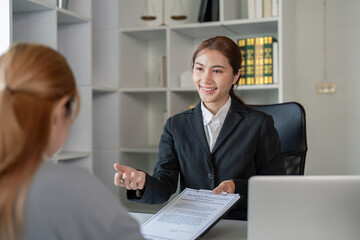 Asian Female Lawyer Conducting Client Meeting in Office