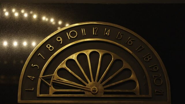 CU Elevator floor indicator going from lobby to fourteenth floor. Old school elevator floor dial shows carriage location.