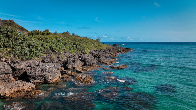 Stunning view of the rocky coastline at Kenting Baishawan beach in Taiwan on a clear sunny day