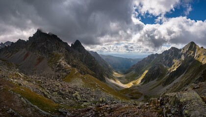Fototapeta premium A beautiful view of the tree-covered mountain peaks and the lush green valley below.