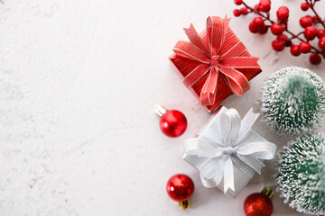 Red and white gift boxes on white marble background. Christmas New year concept. Selective focus.