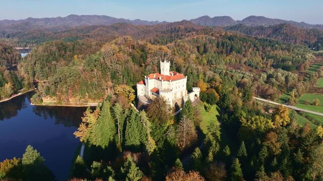 Amazing autumn video with a drone of the majestic old castle and lake of Trakoscan in Zagorje, northern Croatia