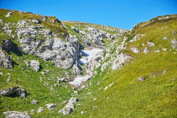 The Caucasian Biosphere Reserve. Mountains and an ice cap in the mountains in August.