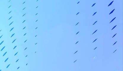 Raindrops cascade down a textured glass window, creating a mesmerizing abstract pattern of blue gradient