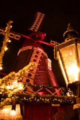 New Year's Mill near an old lantern, at night, in the Christmas Gardens of Tivoli, Copenhagen, Denmark
