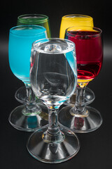 Colorful alcohol in shot glasses.

