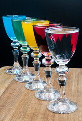 Colorful alcohol in shot glasses.
