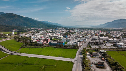 Obraz premium Aerial view of Yuli, Taiwan, highlighting vibrant city life and lush countryside