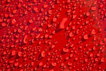 red texture, photo of water drops on a red background