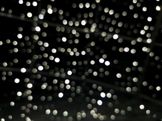 Christmas street decorations. The blurred lights of the Christmas garland.