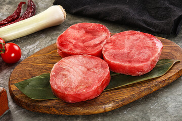Delicous raw tuna medallion for cooking