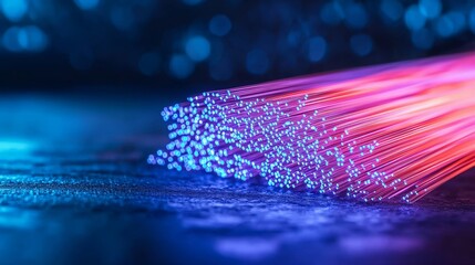 fiber optic installation concept. Vibrant fiber optic cables emitting colorful light in a dark setting.