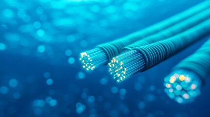 fiber optic installation concept. Underwater fiber optic cables illuminated in a blue ocean environment.