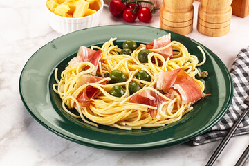 Pasta spaghetti with olives and jamon