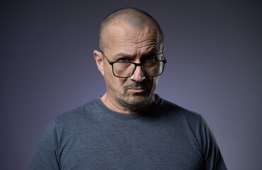 Fototapeta premium Mature man with an expression of skepticism