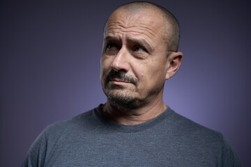 Mature man with an expression of skepticism
