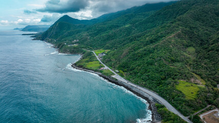 Scenic coastal road along the lush mountains of Hualien Taiwan on a cloudy day © Dave