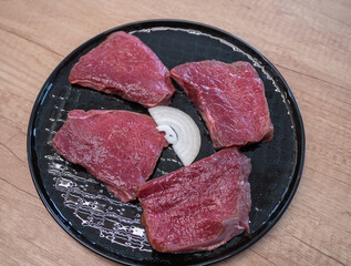 Sliced ​​deer loin ready for processing in the kitchen. Deer meat is among the leanest forms of meat and has a high protein content and is a source of zinc, iron and several vitamins.