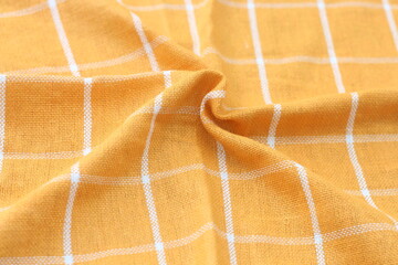 wrinkled classic yellow plaid fabric or tablecloth background