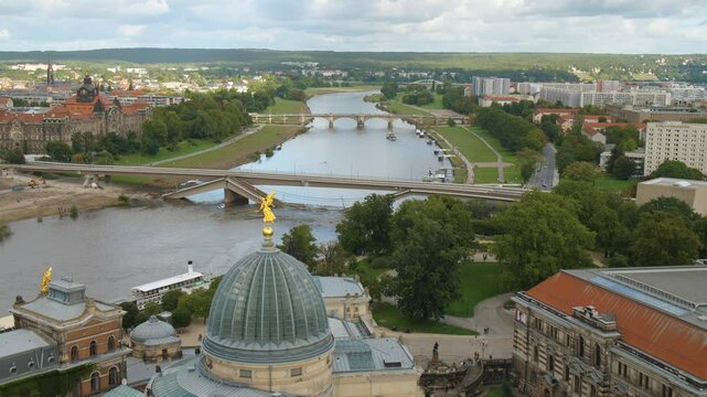 Dresden Sachsen, destroyed Carolabr&uuml;cke Carola Bridge over the Elbe Lipsius-Bau Germany Aerial View from the top of Frauenkirche pan move cloudy sky with Historic and Modern Architecture