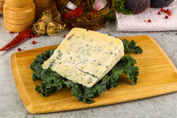 Blue cheese piece over board