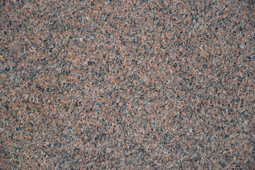 Texture of red polished granite stone with copy space