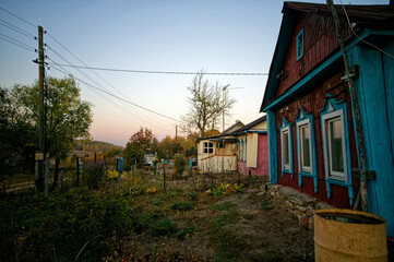 Old house in the village in autumn