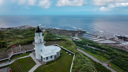Beautiful view of Sandiaojiao Lighthouse overlooking the Taiwan coastline and ocean waves
