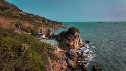 Coastal view of cliffs and shoreline in Taiwan during clear weather with tranquil ocean waters