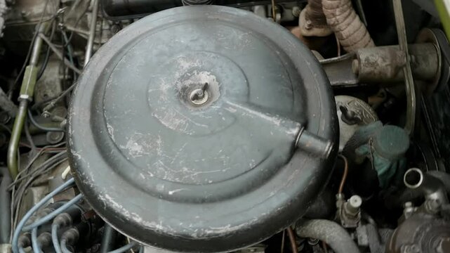 Discover the engine compartment of the  Soviet armored vehicle with details on the radiator, spark plugs, and pipes.