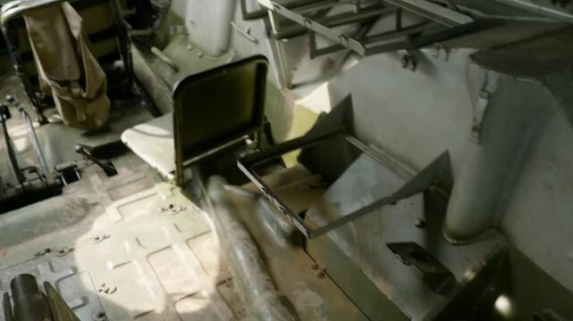 Explore the interior of the Soviet armored vehicle, featuring seats, pillows, and belts for personnel transport and combat support.