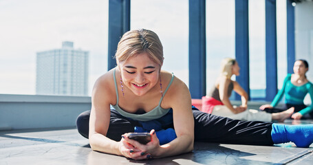 Dancer, stretch and woman with smartphone in class, browsing social media and typing or watching video. Japanese, influencer and warm up with online, audience and performer communication with fans