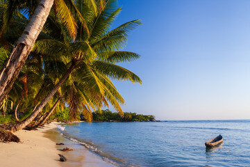 Beach and traditional fishing pirogue, ile aux Nattes (Sainte Marie), Madagascar.