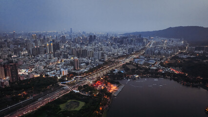 Night view of Kaohsiung cityscape with lights reflecting on the waterfront