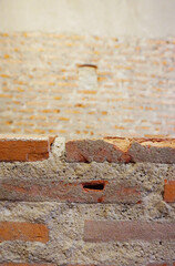 Brick wall at foreground and peel off the surface of red brick texture background