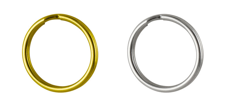 Set of Metal and gold key ring isolated on white background. Wind-up Keychain - Single object. Close-up, studio shot..