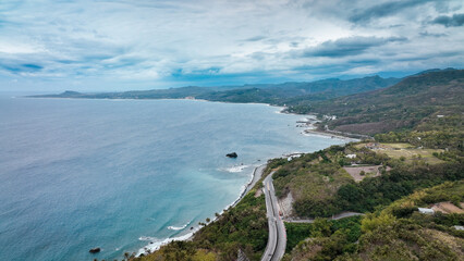 Scenic coastal view of Taiwan showcasing mountains and winding roads near the shoreline