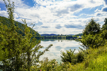 Reservoir on the dam wall at Diemelsee and the surrounding landscape. Nature at the Diemel Dam in the Sauerland.
