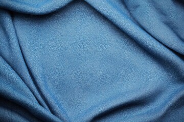 Jeans texture and comfortable concept, A close-up view of textured blue fabric, showcasing intricate patterns and soft draping.