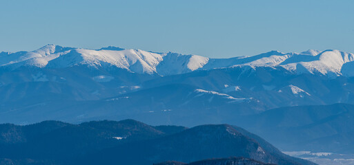 Nizke Tatry mountains between Chopok and Kotliska hill from hiking trail bellow Stoh hill summit in winter Mala Fatra mountains in Slovakia © honza28683