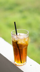 The fresh afternoon iced tea with a straw looks tempting